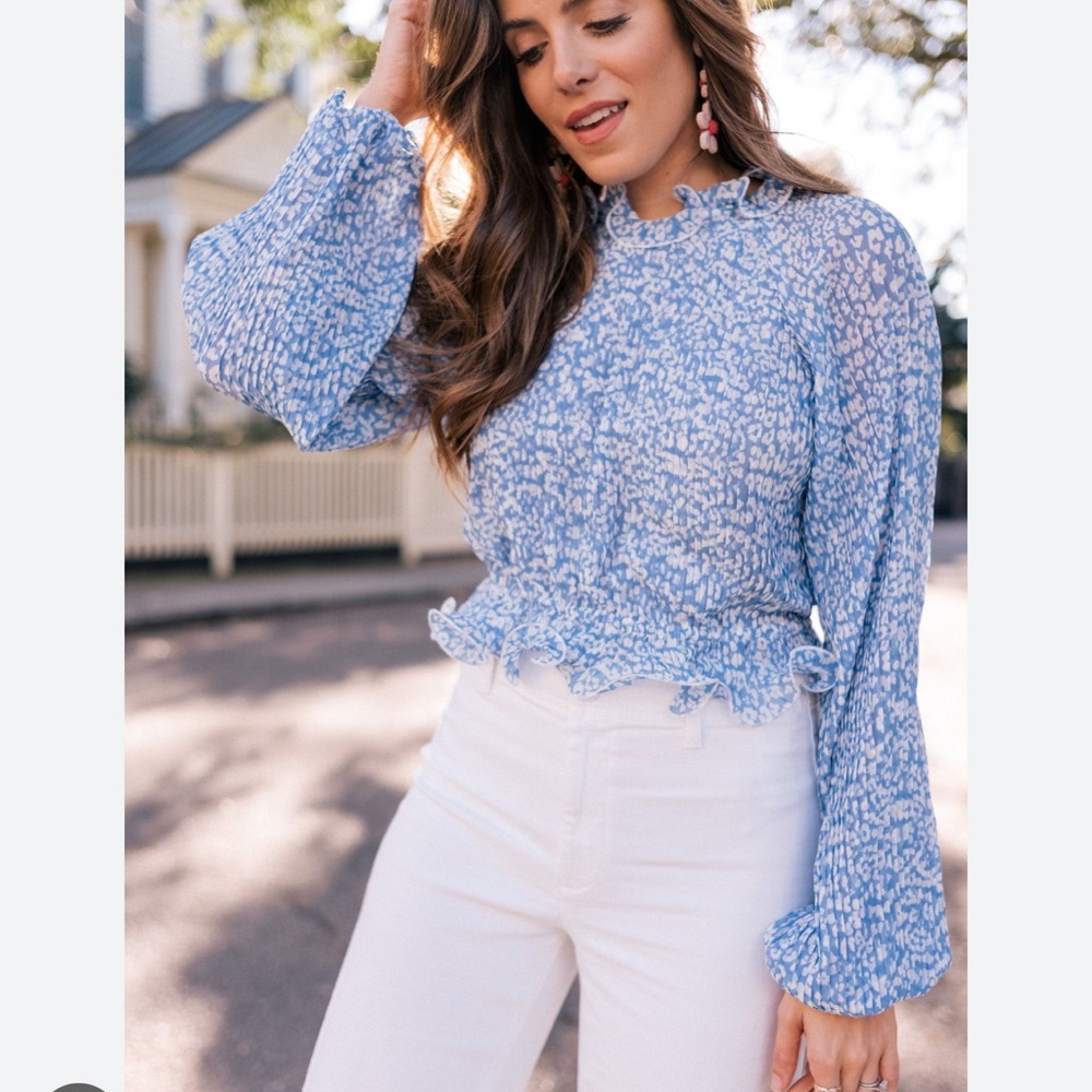 C/MEO Collective top, blue and white print. Size M. IMO fits more like a small.